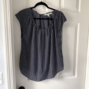 Loose, short sleeve flowy blouse.